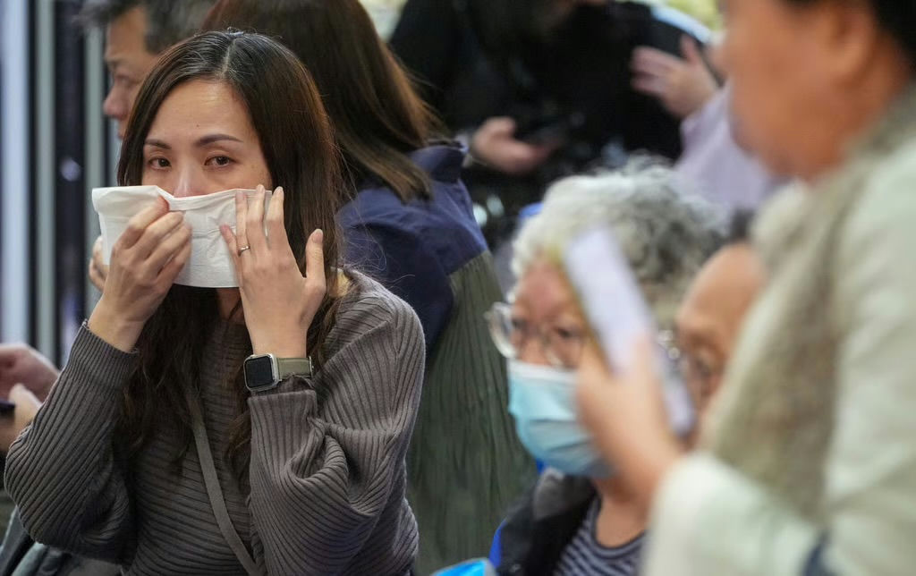 people-woman-tissue-A-person-wearing-mask-A-crowd-A-public-space