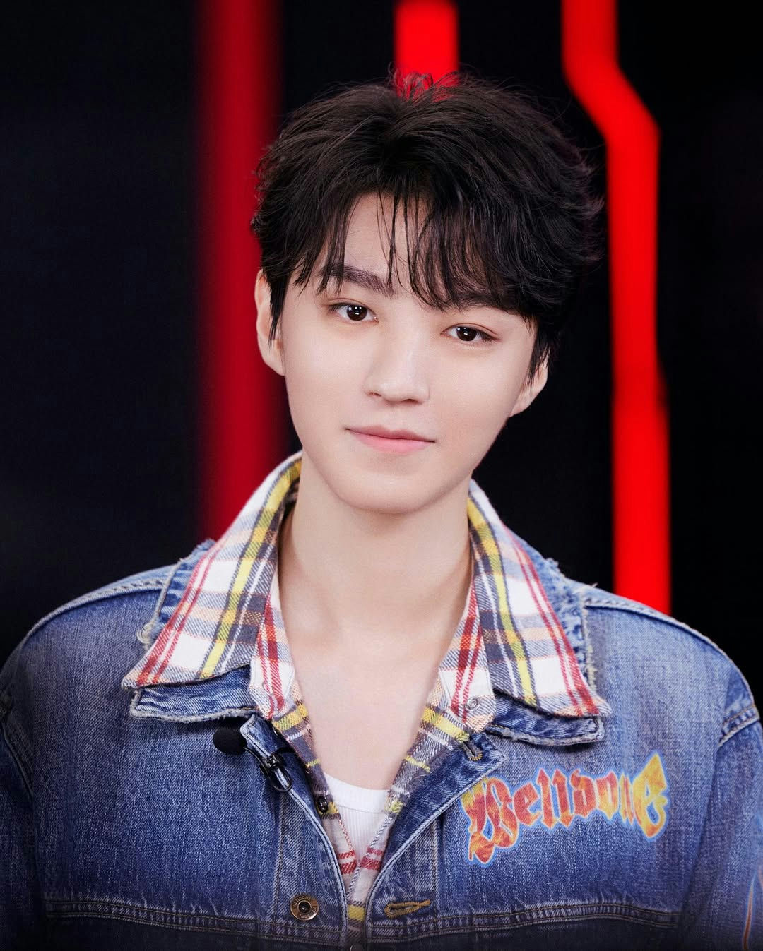 people-male-young adult-Asian-dark hair-black and red background-denim jacket-plaid collar