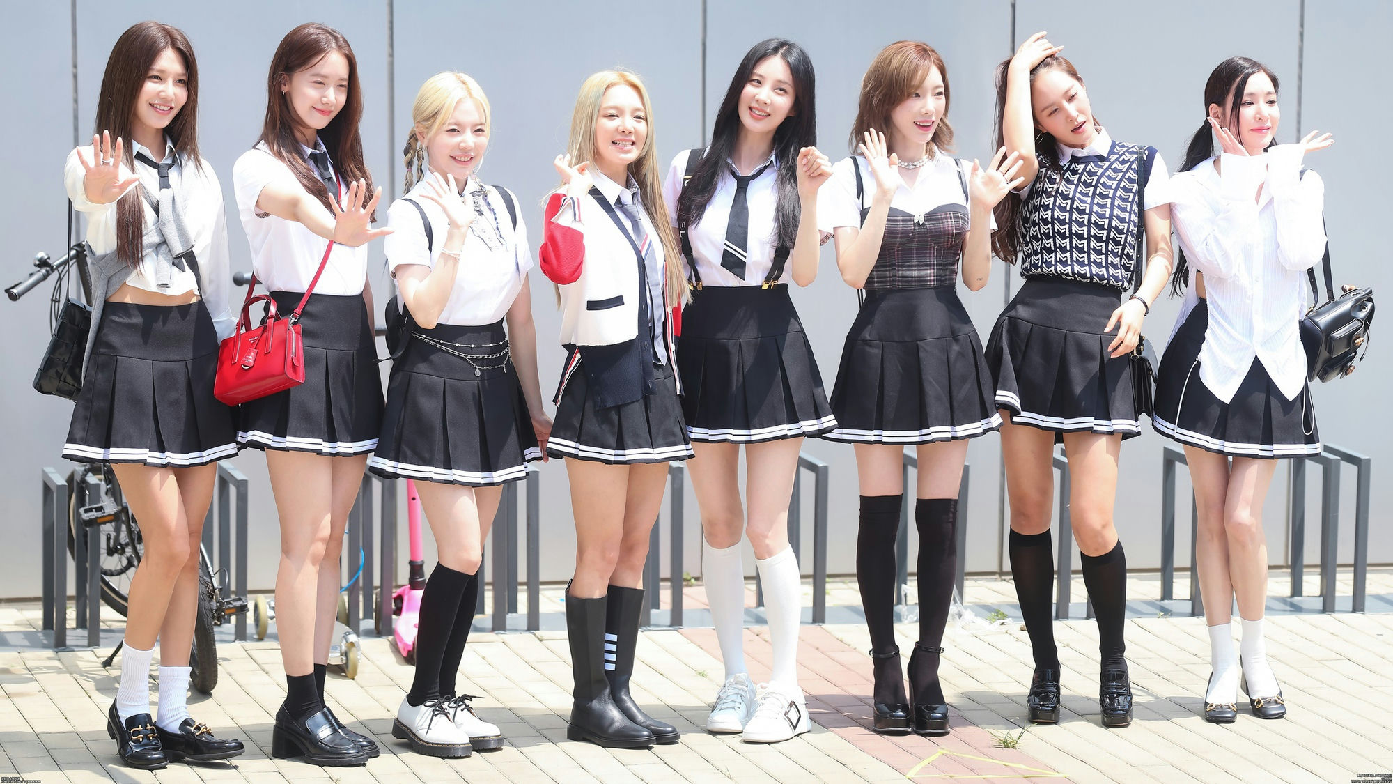 people-7-K-pop-group-A-school-uniform-style-A-pleated-skirts-A-white-shirts-A-waving-A-summer-day