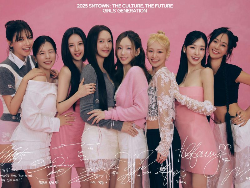 people-8-Girls' Generation-A-pink background-A-smiling-A-group hug-B-light-colored outfits-B-white and pink clothing-C-autographs on image