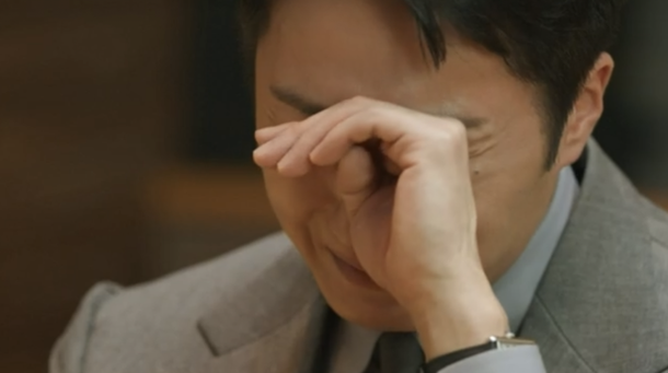 people-man-crying-or-upset-A-wiping-eyes-with-hand-B-wearing-a-suit-C