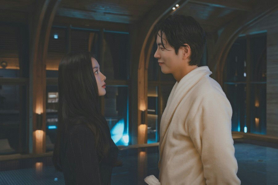 people-woman-long black hair-man-white bathrobe-indoor setting-romantic gaze