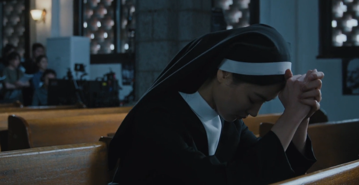 people-1-nun-A-praying-A-church-A-filming_crew