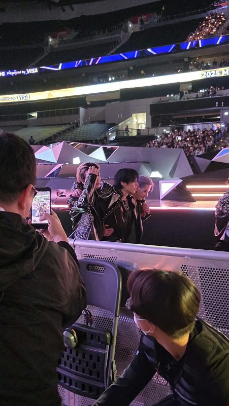 people-3-rock-A-studded-leather-jackets-A-stage-side-A-filming-with-phone