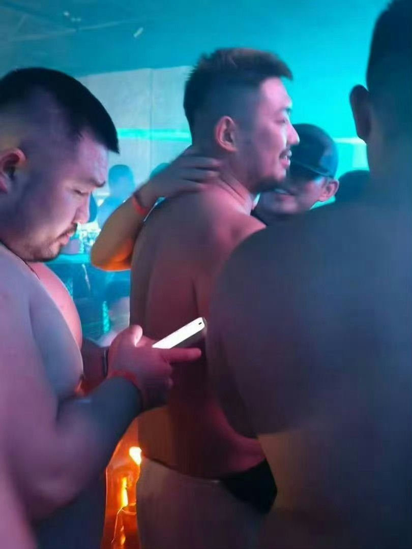 people-Three men-A-shirtless-A-hugging-A-nightclub