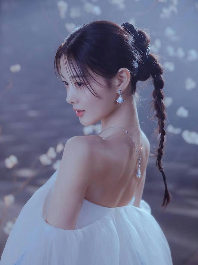 people-woman-A-ethereal-A-white dress-A-braided hair-A-delicate jewelry