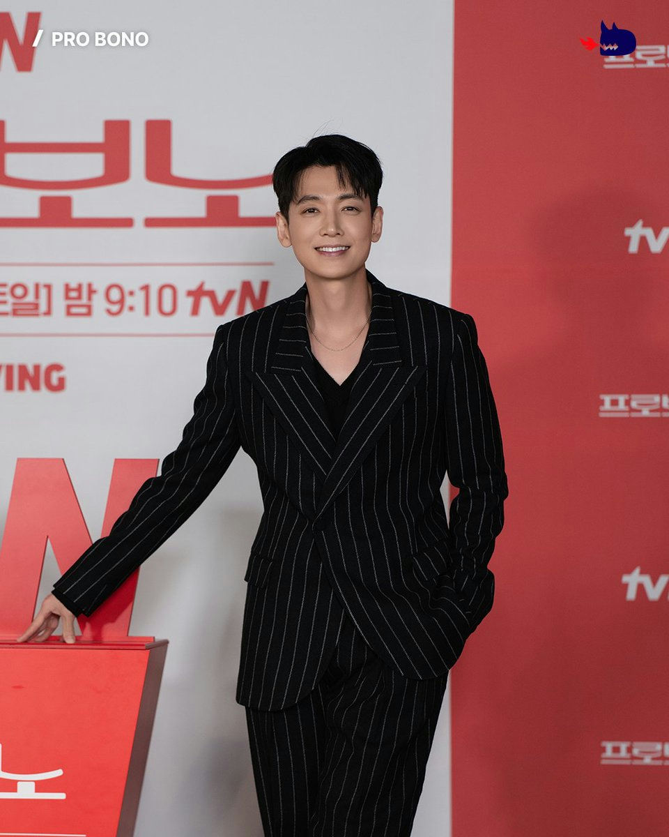 people-A-Korean actor-A-pinstripe suit-A-smiling-A-red backdrop