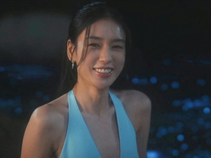 people-woman-smiling-A-blue halter top-B-night setting-C-earrings