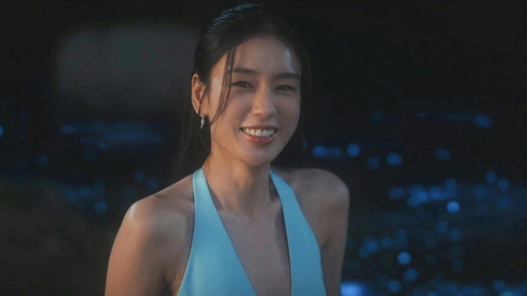 people-woman-smiling-A-blue halter top-B-night setting-C-earrings