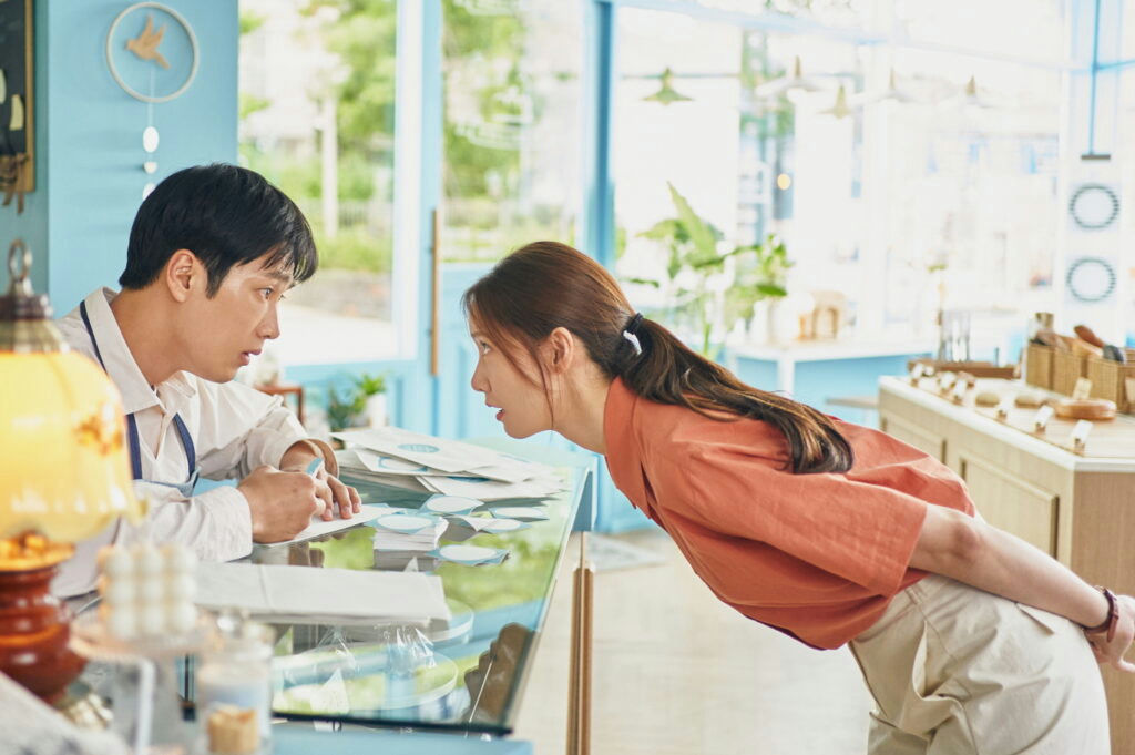 people-A-man-A-woman-A-intense-interaction-B-counter-B-indoors-C-business