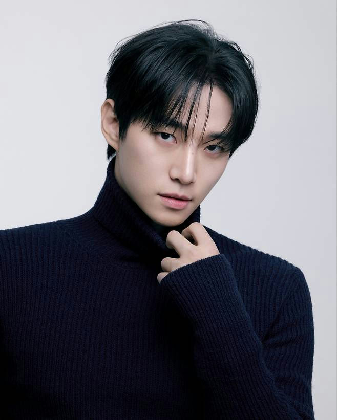 people-man-A-black turtleneck-B-dark hair-C-intense gaze
