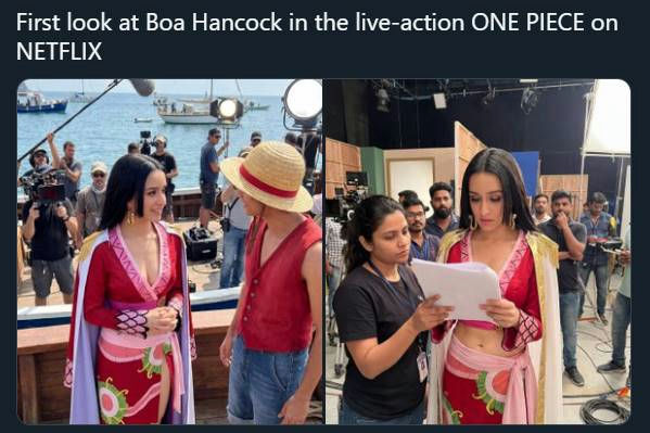 people-Woman in red and pink costume-Boa Hancock-Woman in black shirt reading paper-Crew member-Man in straw hat and red vest-Luffy-Filming set-Outdoor and indoor scenes