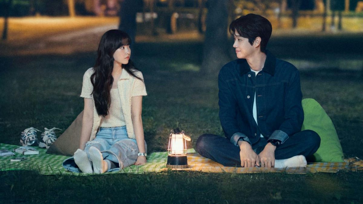 people-two people-A-couple sitting outdoors-A-picnic at night-B-illuminated by lantern-C-Korean drama aesthetic