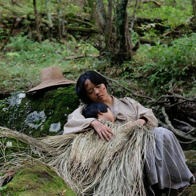 people-Woman and child-A-resting-A-forest-A-straw blanket-A-mossy rock