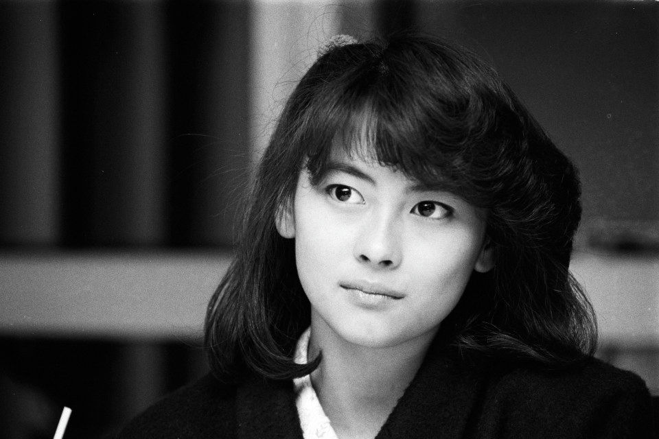 people-young woman-black and white-Japanese-medium close-up-dark hair-looking away