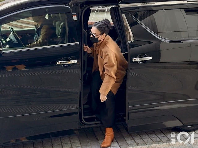 people-woman-A-exiting-car-A-black-face-mask-B-brown-jacket-C-brown-boots