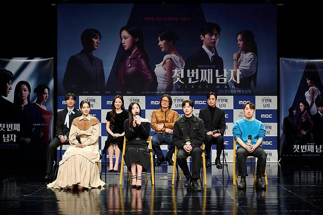people-9-stage-A-press-conference-B-korean-drama-C-seated-D-holding-microphone