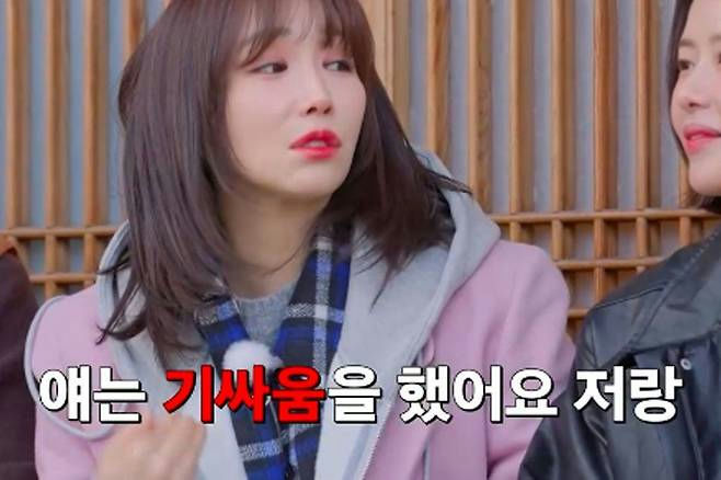 people-woman with brown hair and pink jacket-speaking-woman with dark hair and black jacket-listening