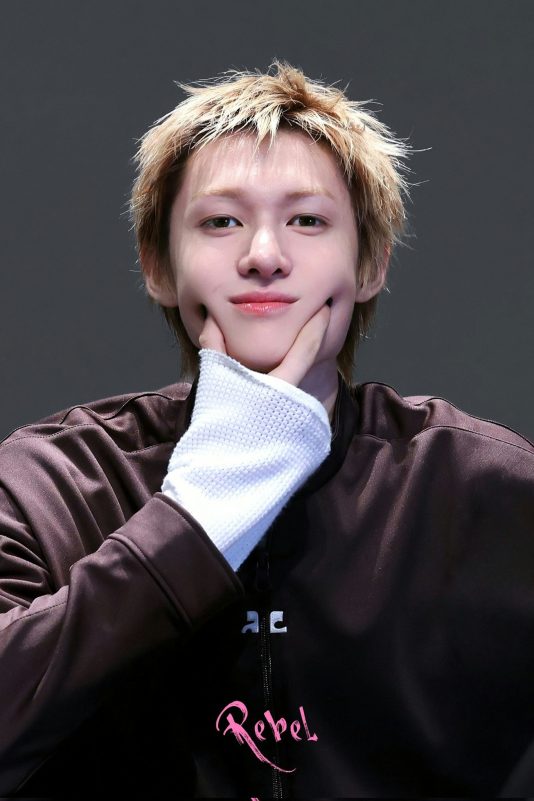 people-A-male idol-A-blond hair-B-pouting-C-brown jacket