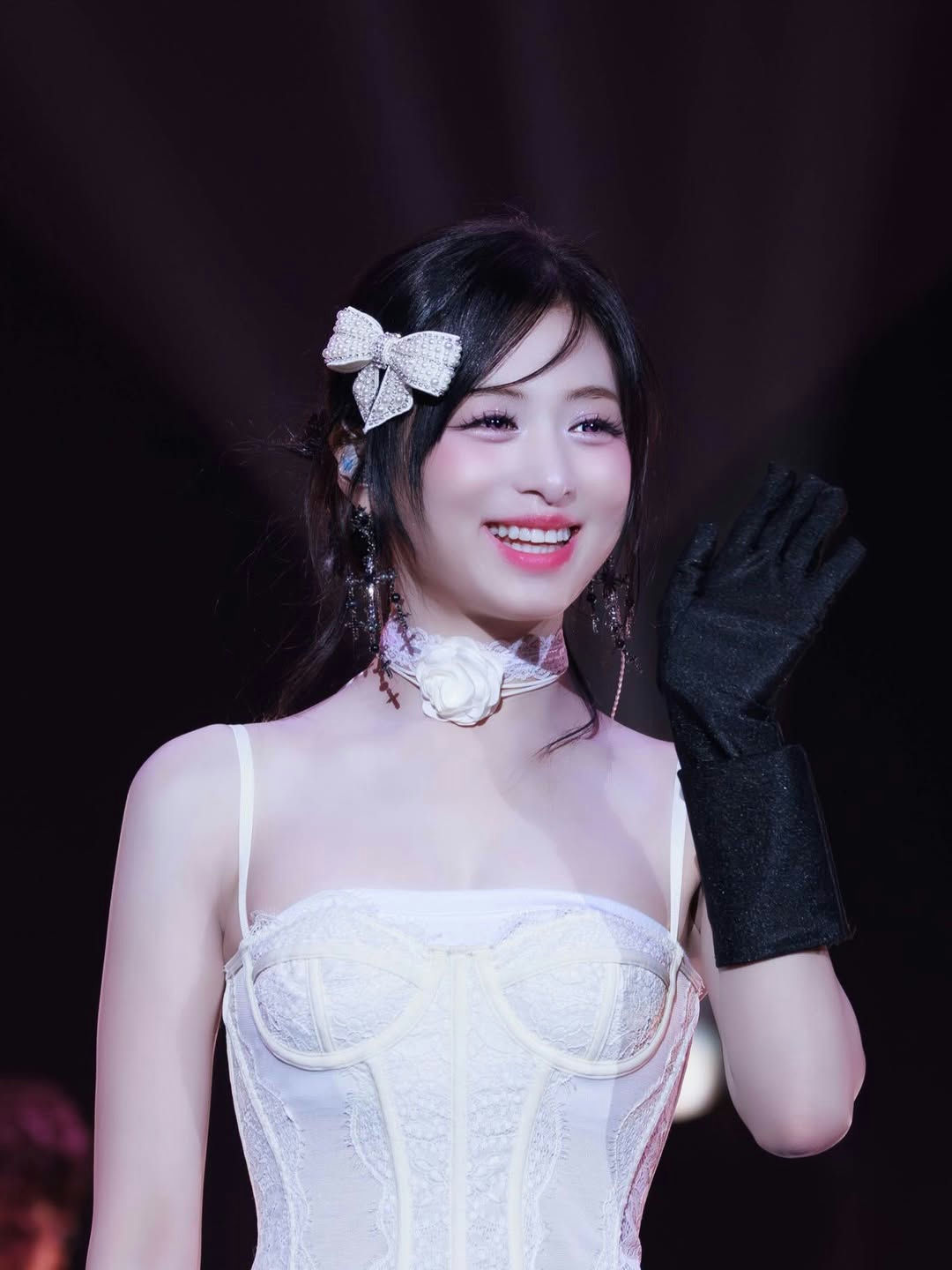 people-female idol-A-smiling-A-white corset top-A-black opera glove-A-sparkling bow hair accessory