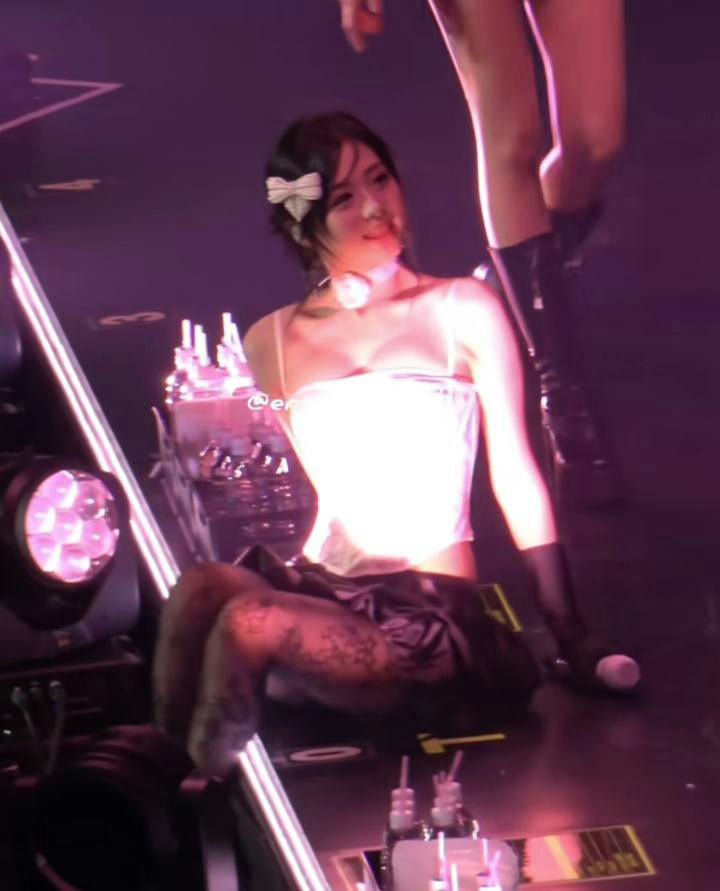 people-woman-performer-A-stage-A-white-corset-A-patterned-tights-A-pink-lighting