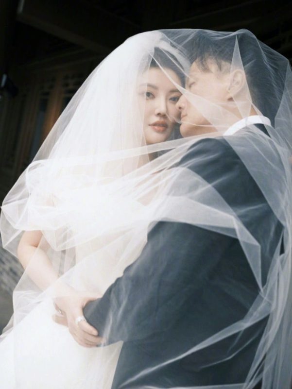 people-A-bride-A-groom-B-wedding-veil-C-intimate-embrace