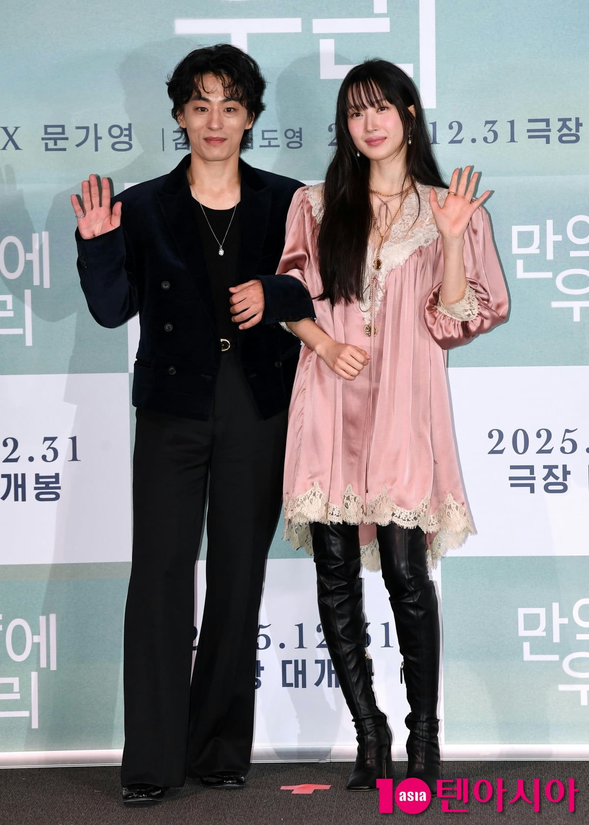 people-male actor-A-female actress-B-waving hands-C-pink satin dress-D-black velvet blazer-E-thigh-high boots