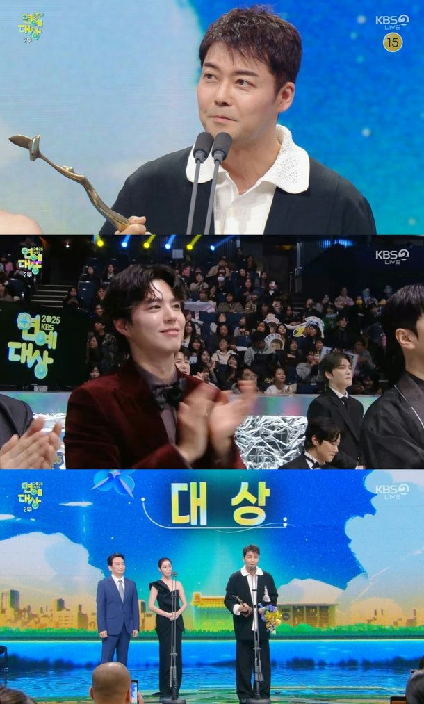 people-Man holding award-Speaking into microphones-Man clapping and smiling-Three people on stage-Award ceremony