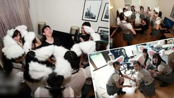 people-Several young women and one man-A-fluffy white earmuffs/headwear-A-Japanese-style school uniforms (plaid skirts, white shirts, vests)-B-Social gathering/party setting-C-Enthusiastic/Playful mood