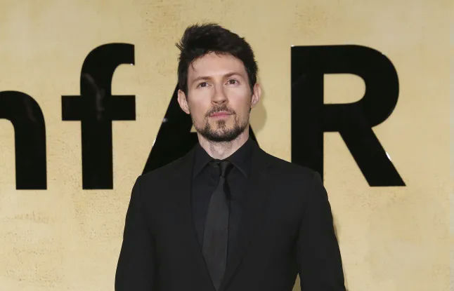 people-Man-Formal attire-Black suit-Goatee-amfAR backdrop
