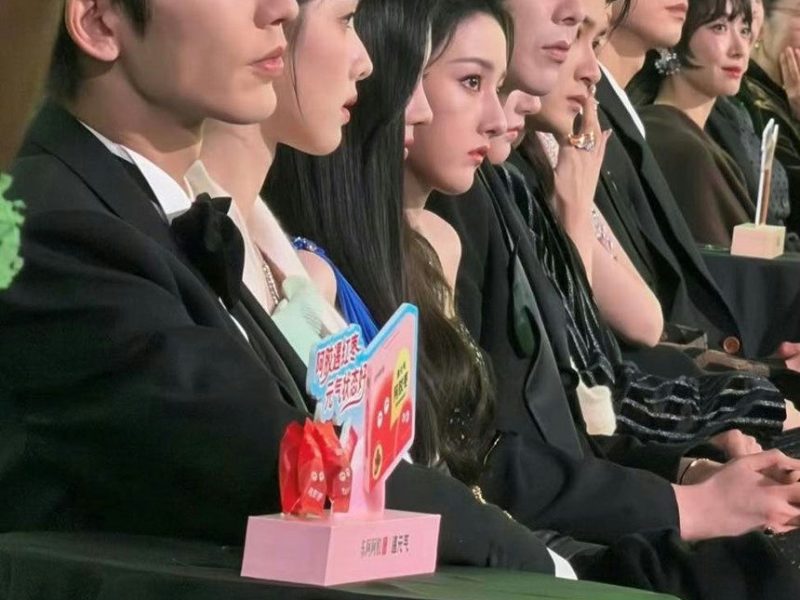 people-A-Chinese celebrities-A-attending an event-A-seated in a row-A-formal wear-A-side profile