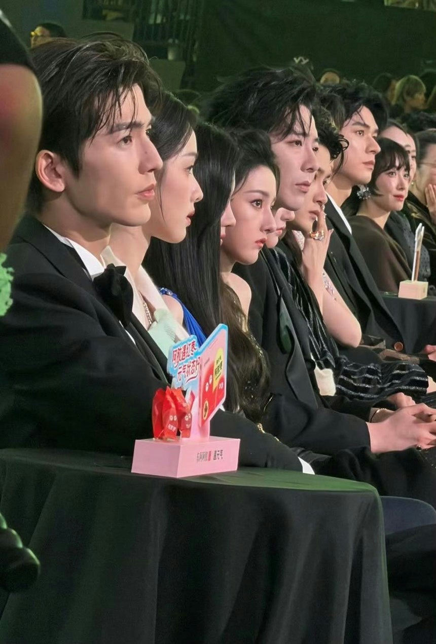 people-A-Chinese celebrities-A-attending an event-A-seated in a row-A-formal wear-A-side profile
