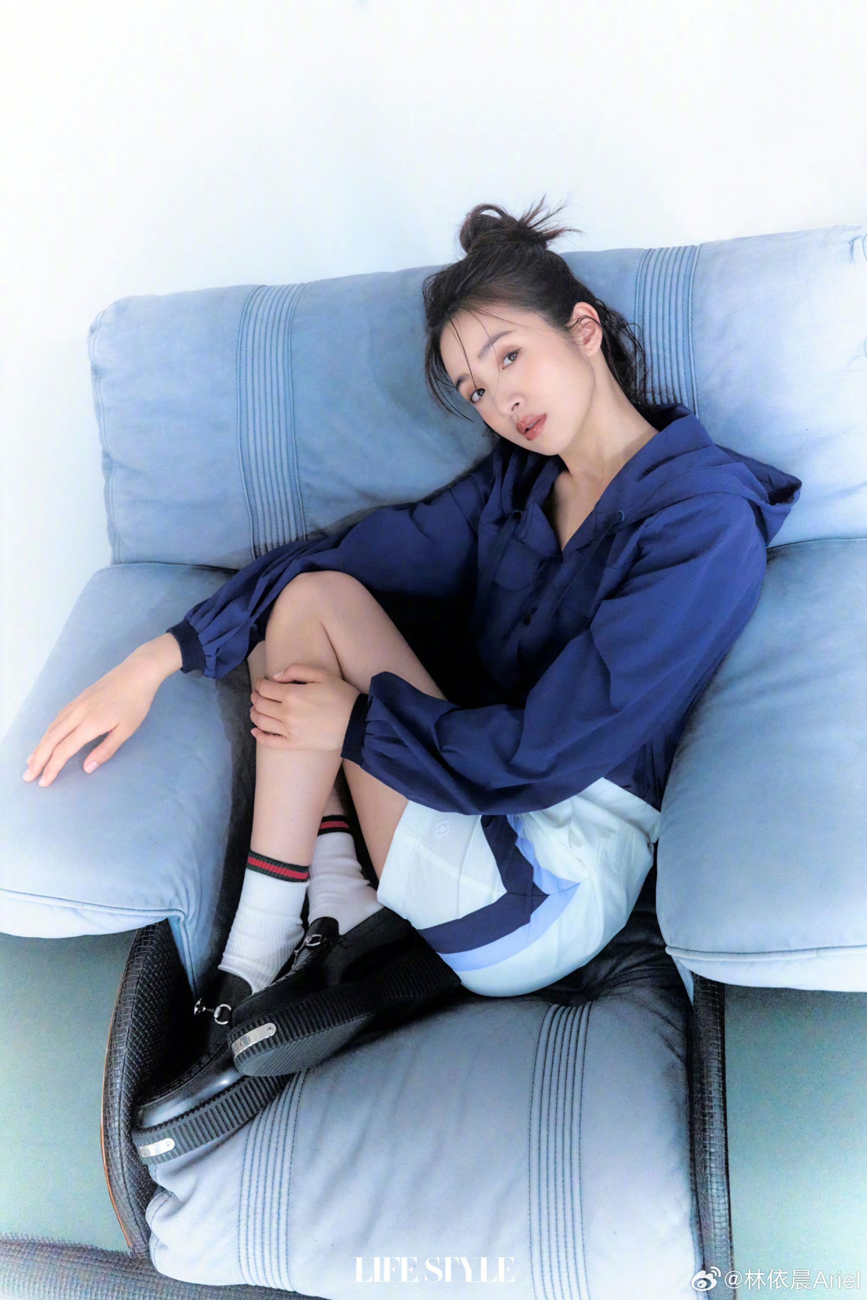 people-1-woman-A-sitting-A-blue-hoodie-B-white-shorts-C
