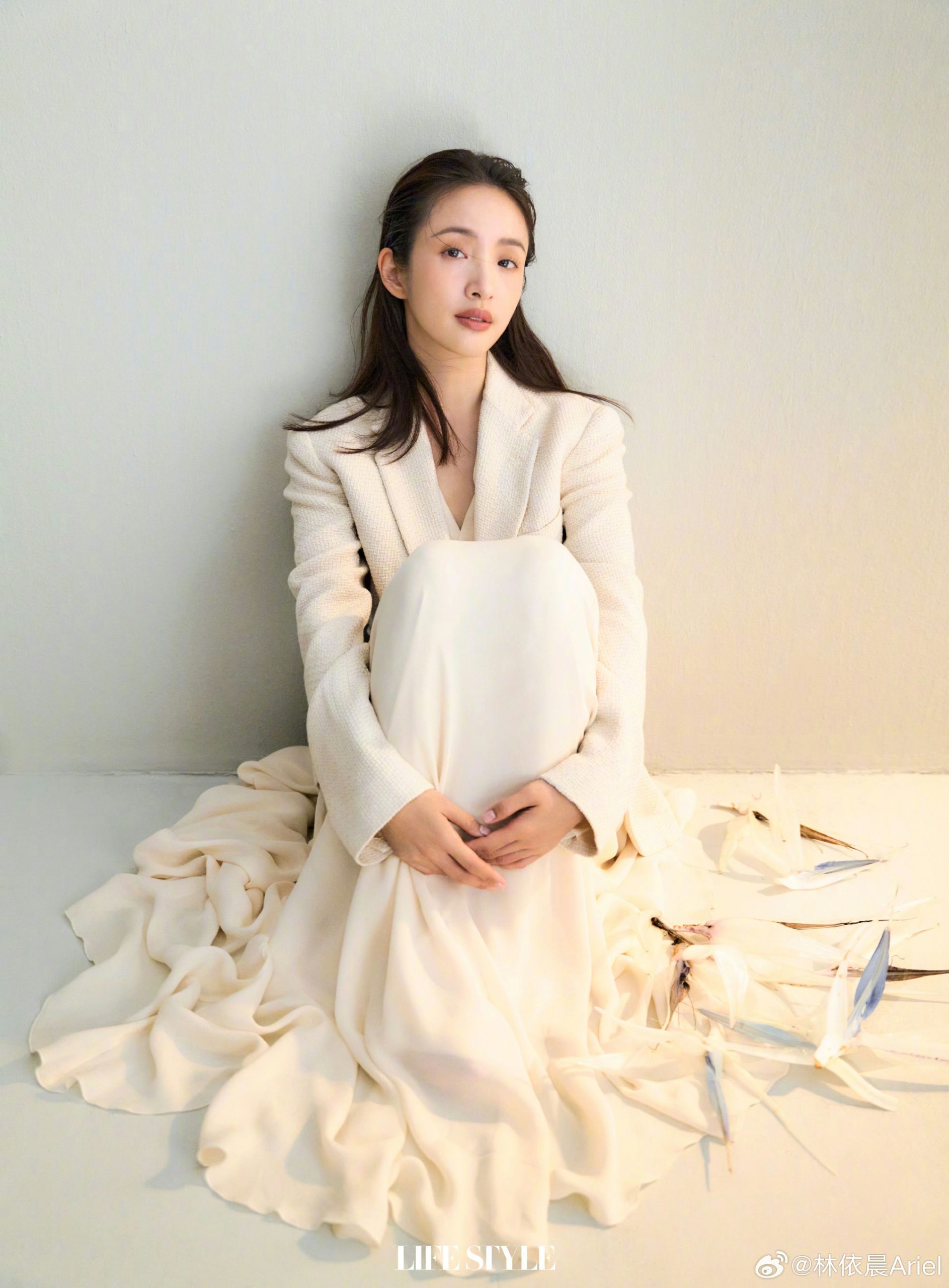 people-A-woman-A-sitting-A-all-white-clothing-A-elegant-A-soft-lighting