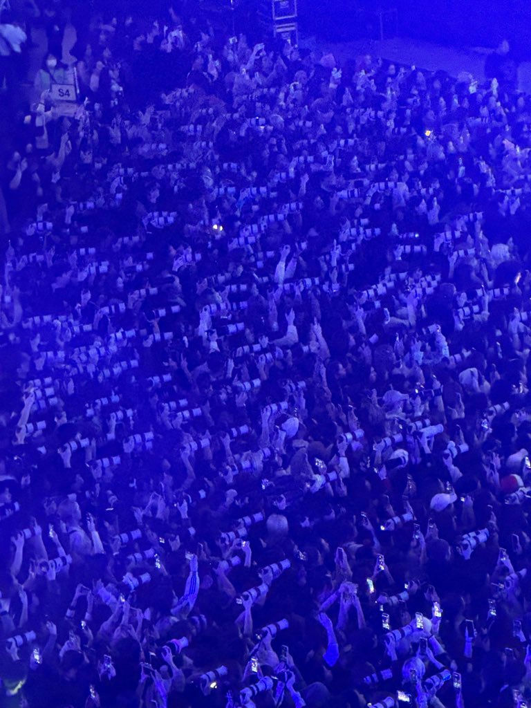 people-crowd-A-cameras-A-blue-lighting-A-concert