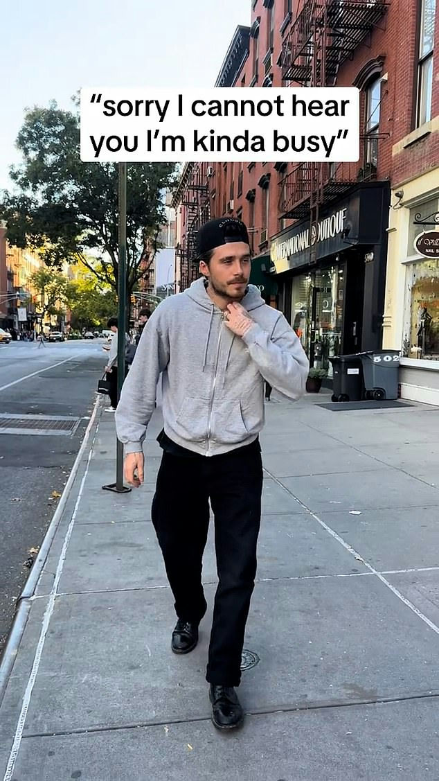 people-1-man-A-walking-A-street-A-hoodie