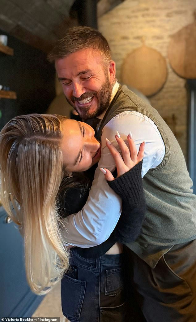 people-David Beckham-A-hug-A-Harper Seven Beckham-A-smiling-A-blond hair-B-affectionate embrace-C