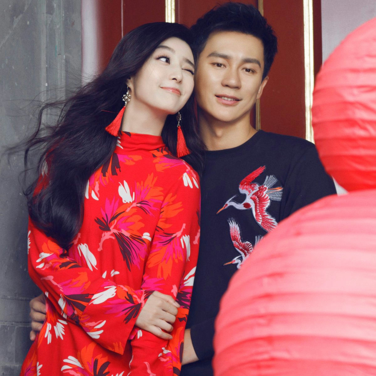 people-woman-red floral dress-man-black embroidered shirt-couple-Chinese lanterns
