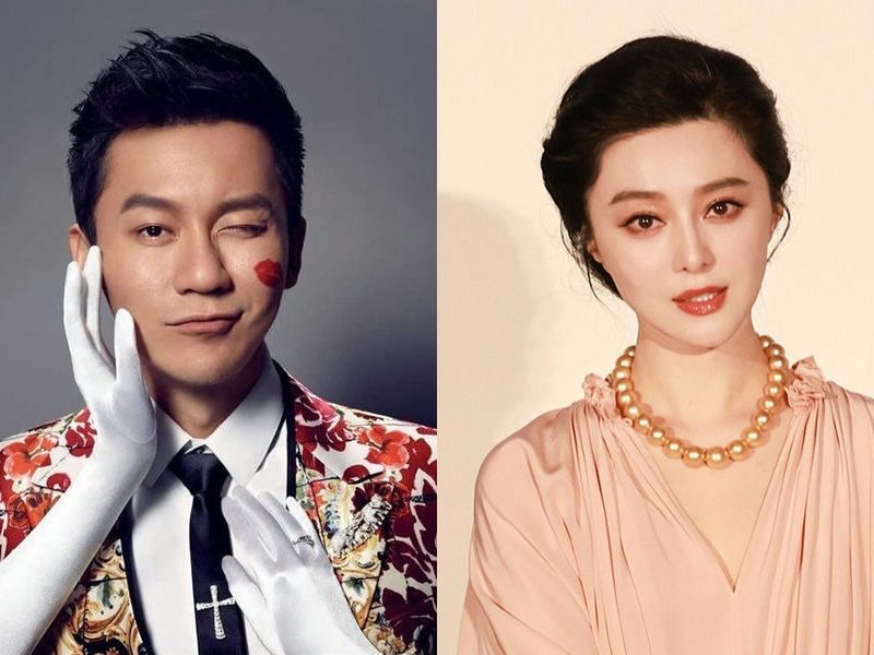people-male actor-winking-lipstick kiss mark-floral suit-female actress-pink dress-gold pearl necklace