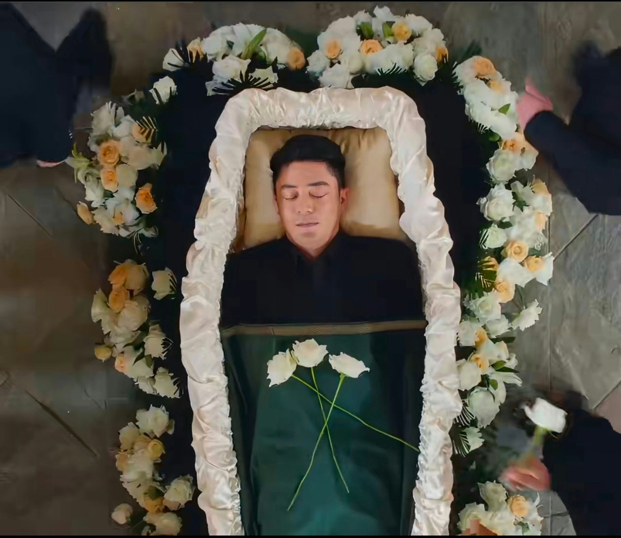 people-one man-A-coffin-A-funeral-A-flowers-A-closed eyes