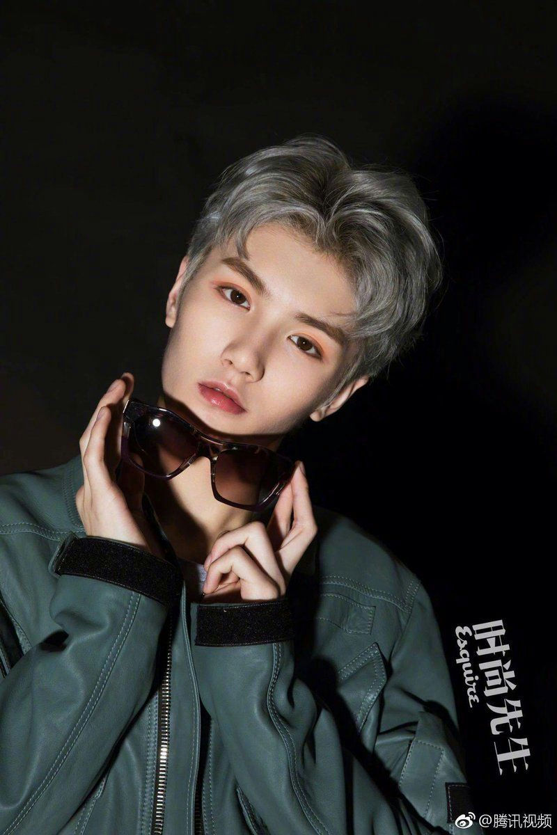 people-male-Asian-A-silver hair-A-holding sunglasses-A-green leather jacket-B-dark background-C