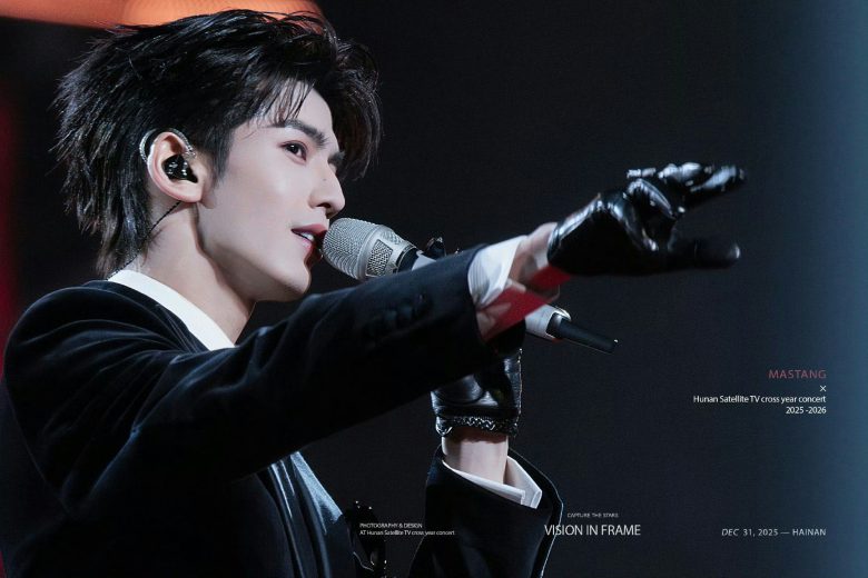 people-A-male singer-A-performing-B-in-ear-monitor-B-black-suit-C-gloved-hand