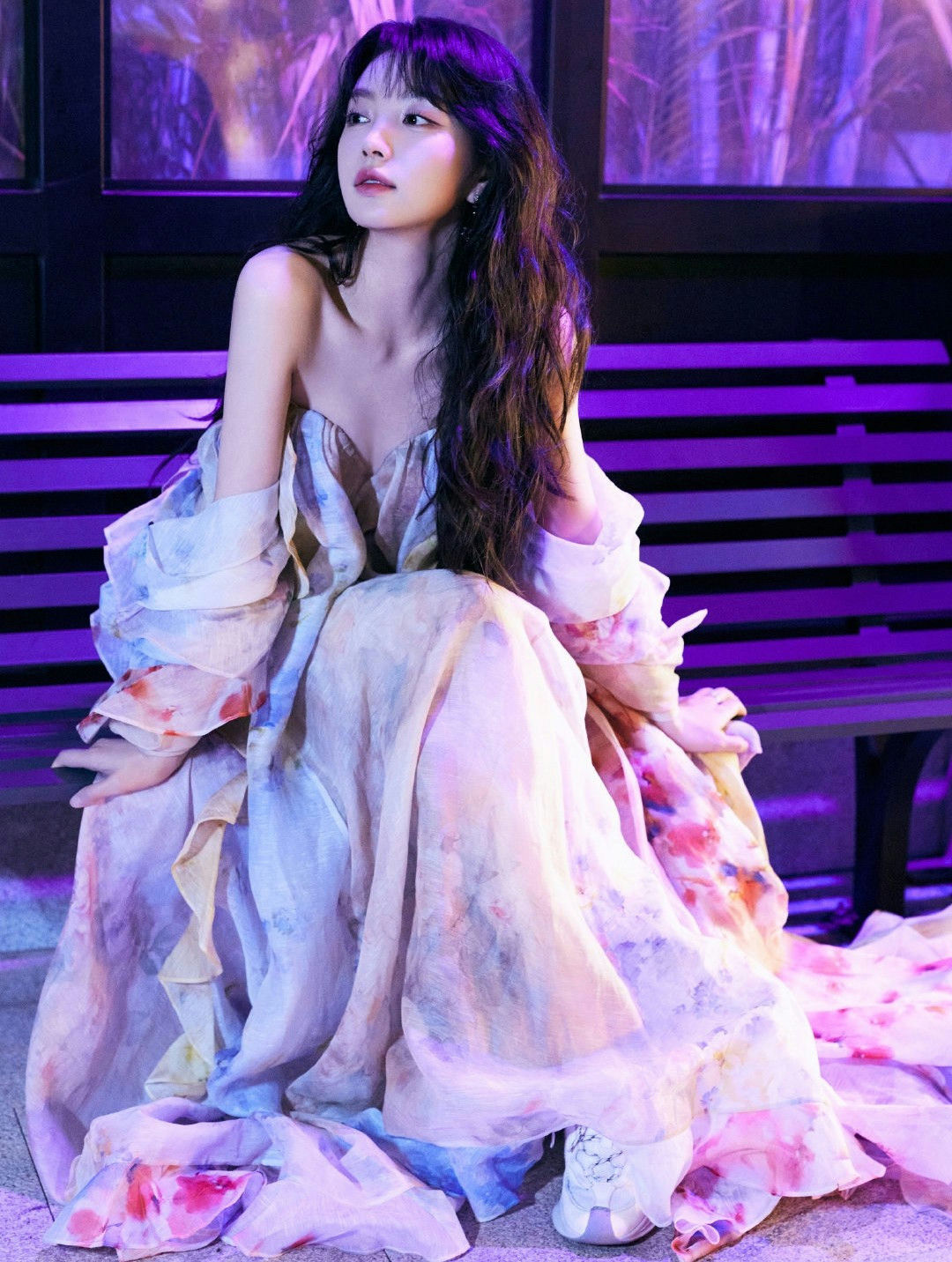 people-Seolhyun (Kim Seol-hyun)-A-long dark hair-A-strapless floral dress-B-purple lighting-C-sitting on a bench