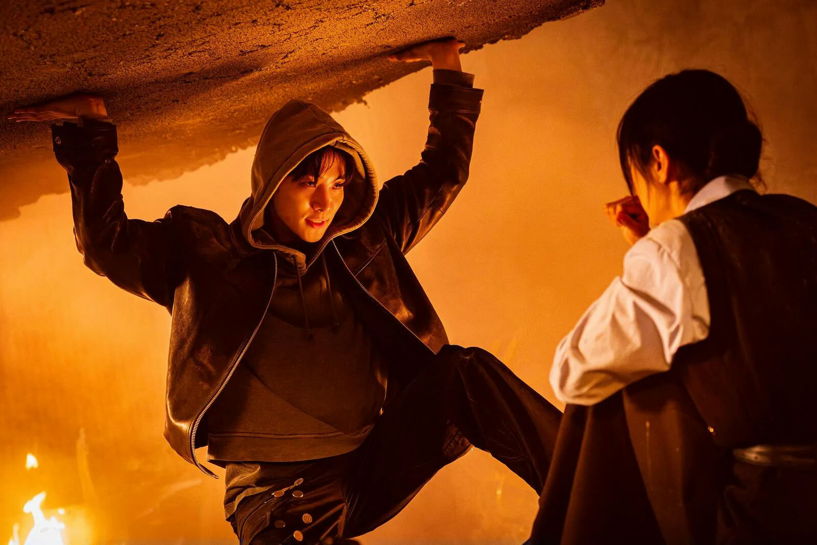 people-Park Seo-joon-A-holding-up-ceiling-A-hooded-jacket-B-intense-expression-C-another-person-watching