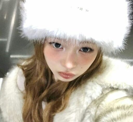 people-woman-A-white fur hat-A-brown hair-A-white fur coat-A-pouty expression
