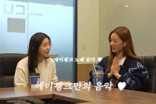 people-Eunji & Hayoung (Apink members)-Interview setting-Sitting at a table-Korean subtitles-Drinking coffee