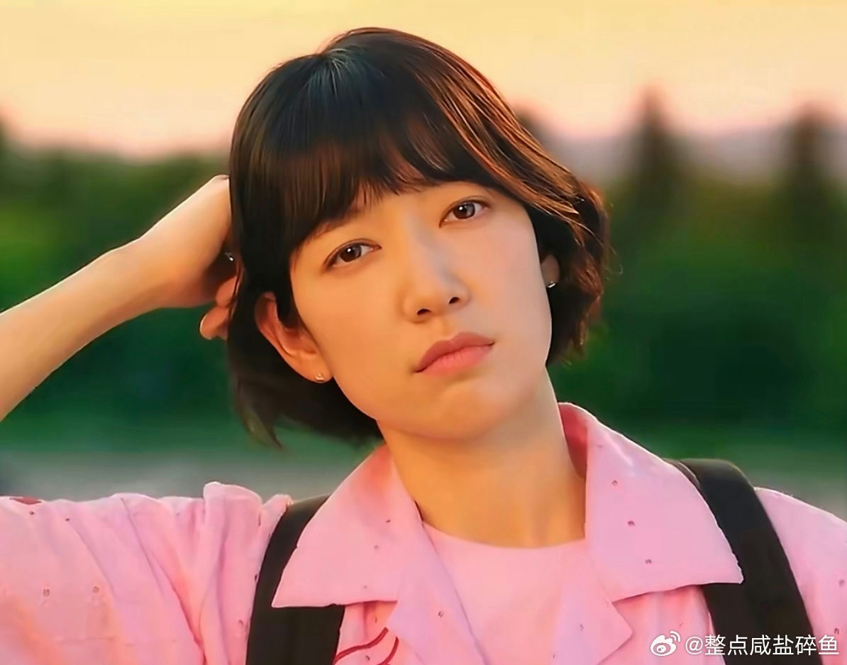 people-Zhou Ye-short brown hair-pink collared shirt-outdoor setting-hand touching head