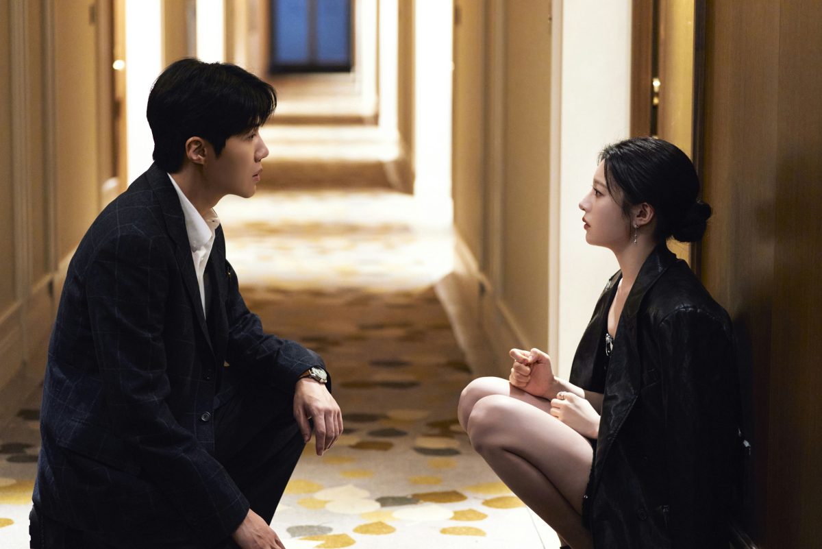 people-Two East Asian actors-A-crouching-A-intense gaze-B-hallway-B-indoor lighting-C-dramatic conversation