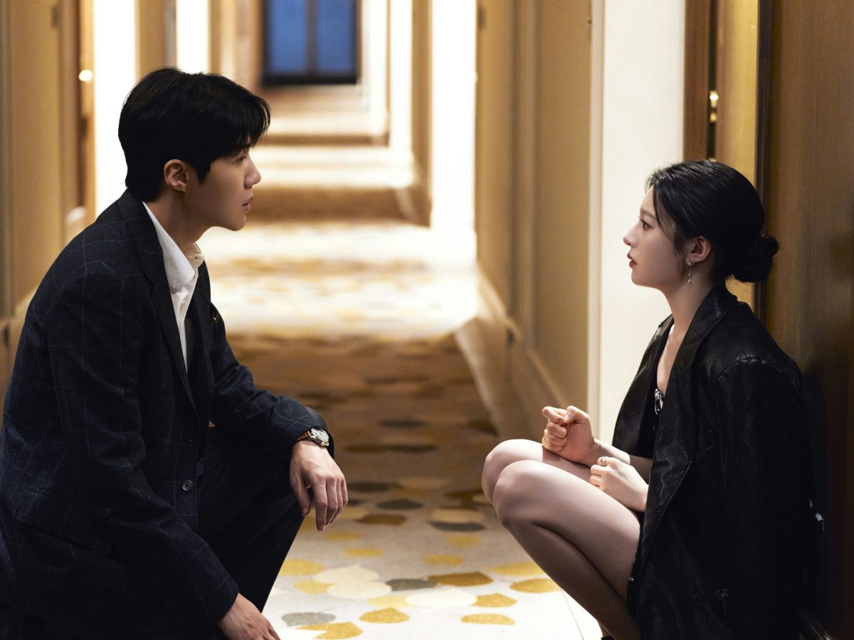 people-Two East Asian actors-A-crouching-A-intense gaze-B-hallway-B-indoor lighting-C-dramatic conversation