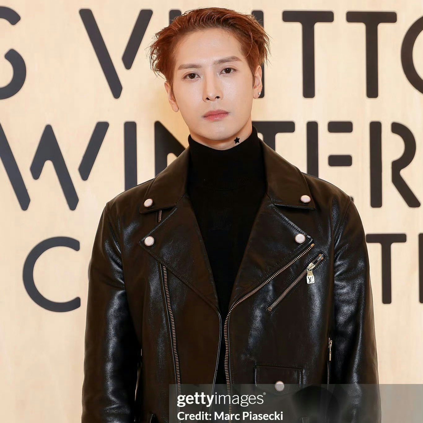 people-Jackson Wang-black leather jacket-black turtleneck-star tattoo on neck-Louis Vuitton event